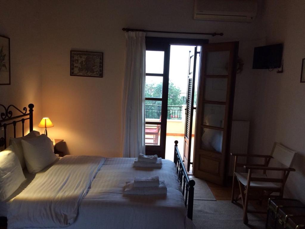 Postel nebo postele na pokoji v ubytování Alexandraki Rooms