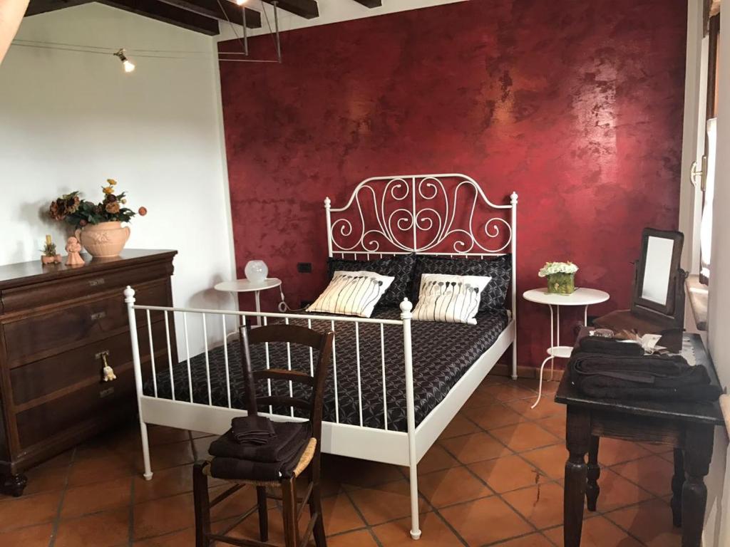 Postel nebo postele na pokoji v ubytování B&B Il Martin Pescatore