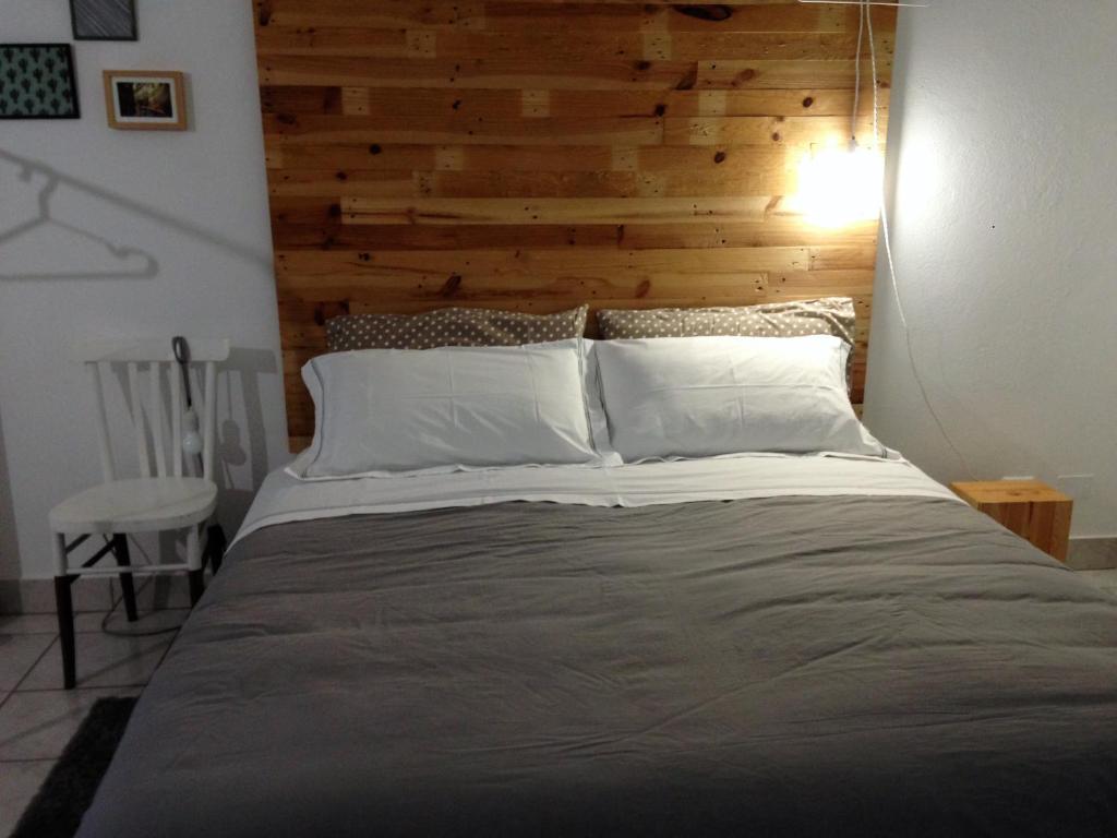 A bed or beds in a room at Alloggio OpenSpace da Irene