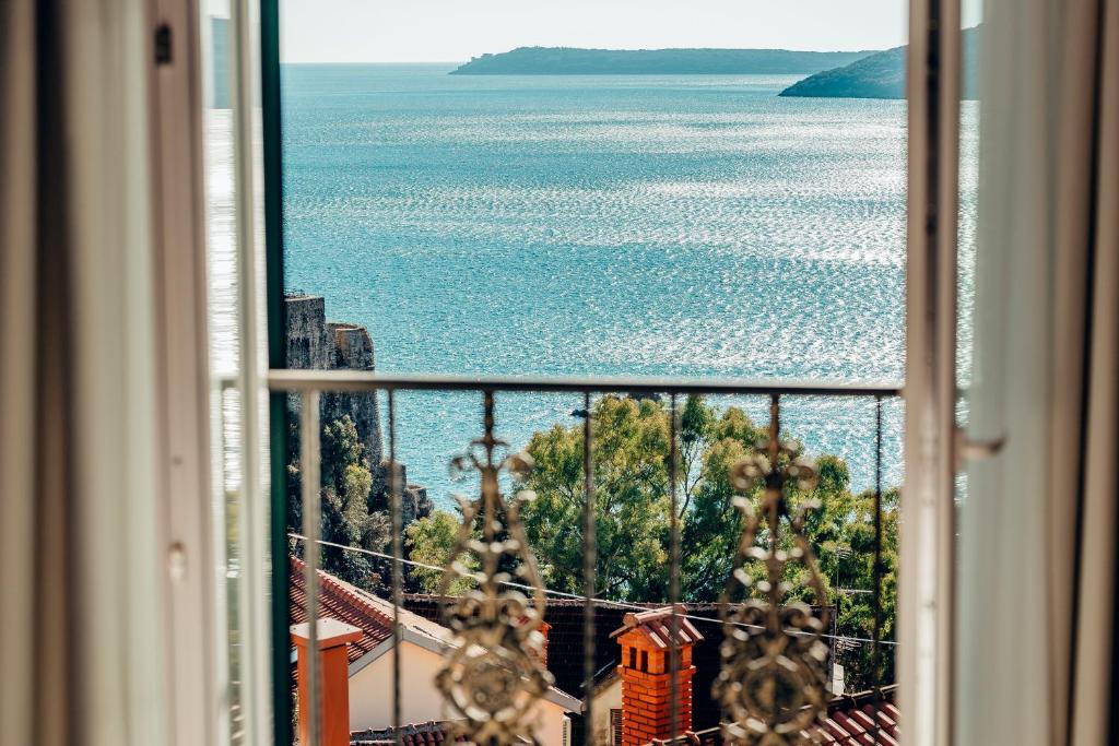 a view of the ocean from a window at Apartments Master 5 in Herceg-Novi