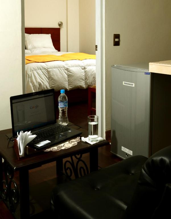 Postel nebo postele na pokoji v ubytování Golden Inca Hotel