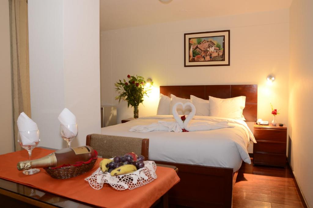 Postel nebo postele na pokoji v ubytování Golden Inca Hotel