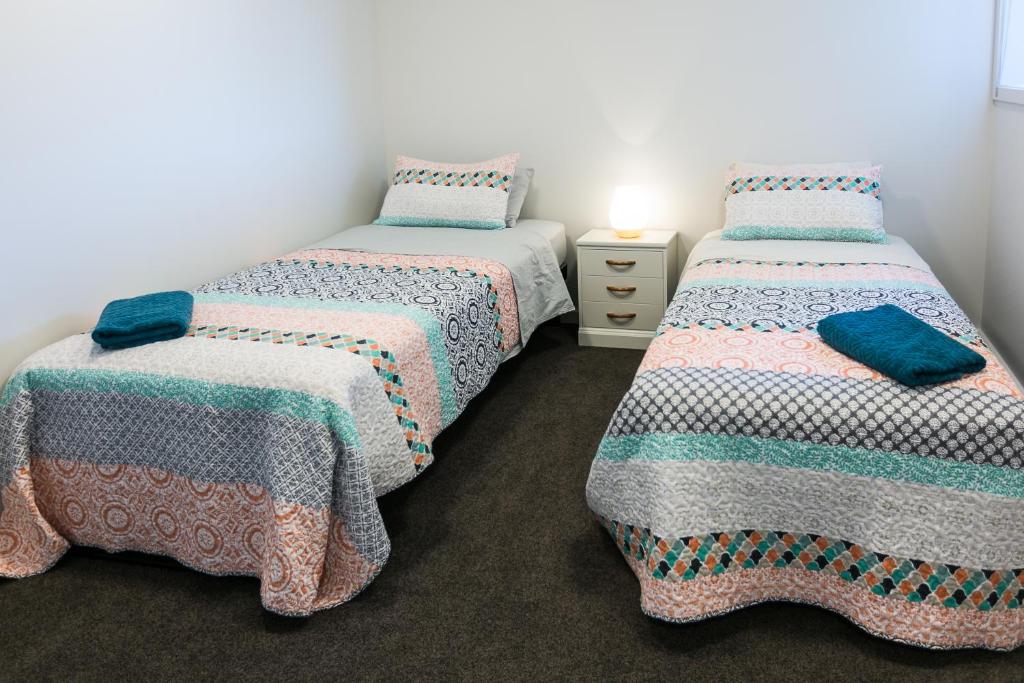 Postel nebo postele na pokoji v ubytování Riverwalk Apartments