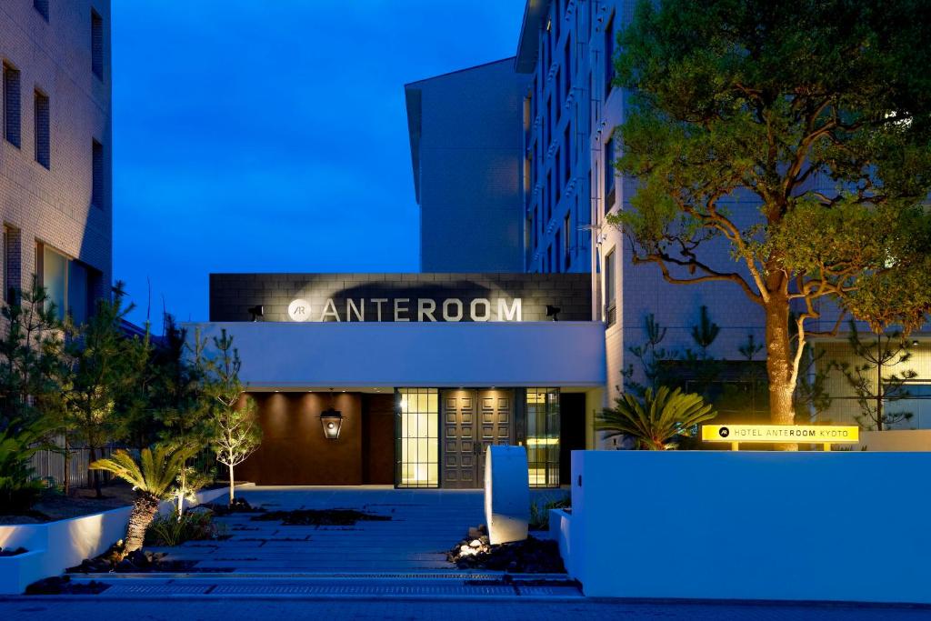 a building with a sign that reads entranceowment at night at Hotel Anteroom Kyoto in Kyoto