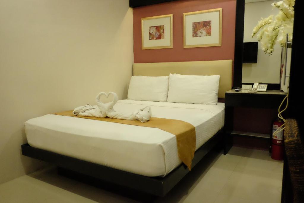Postel nebo postele na pokoji v ubytování Hotel Stella