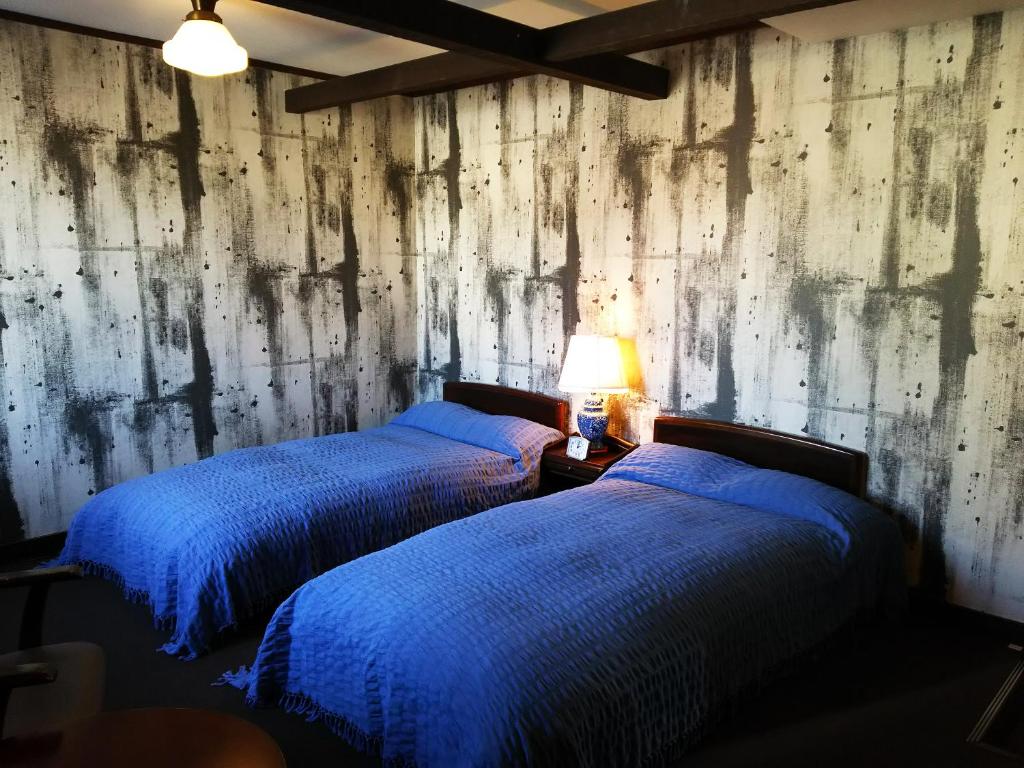 Letto o letti in una camera di Rickshaw inn