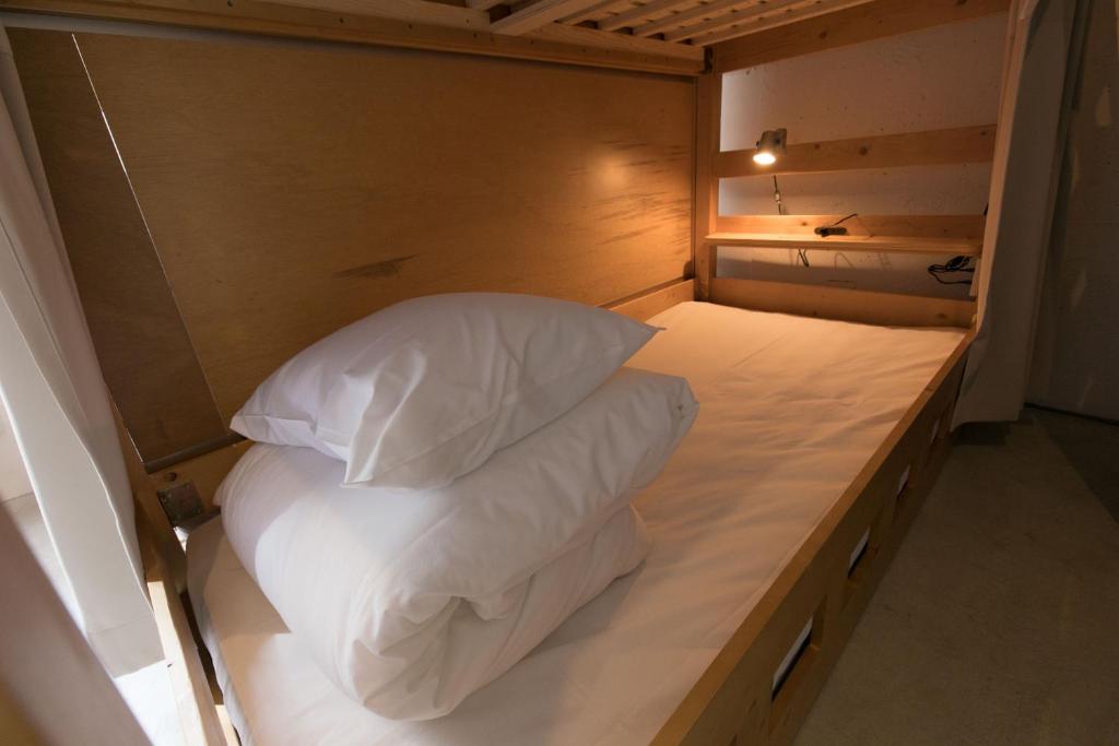 Postel nebo postele na pokoji v ubytování hostel DEN