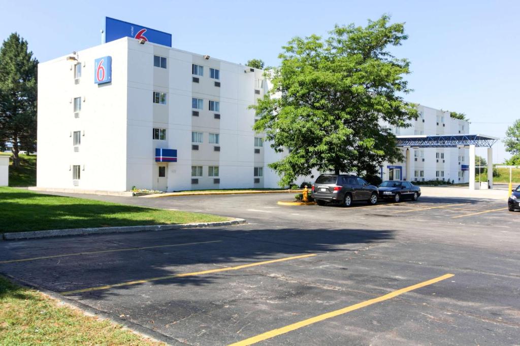 a parking lot in front of a white building at Motel 6-Portland, ME in Portland