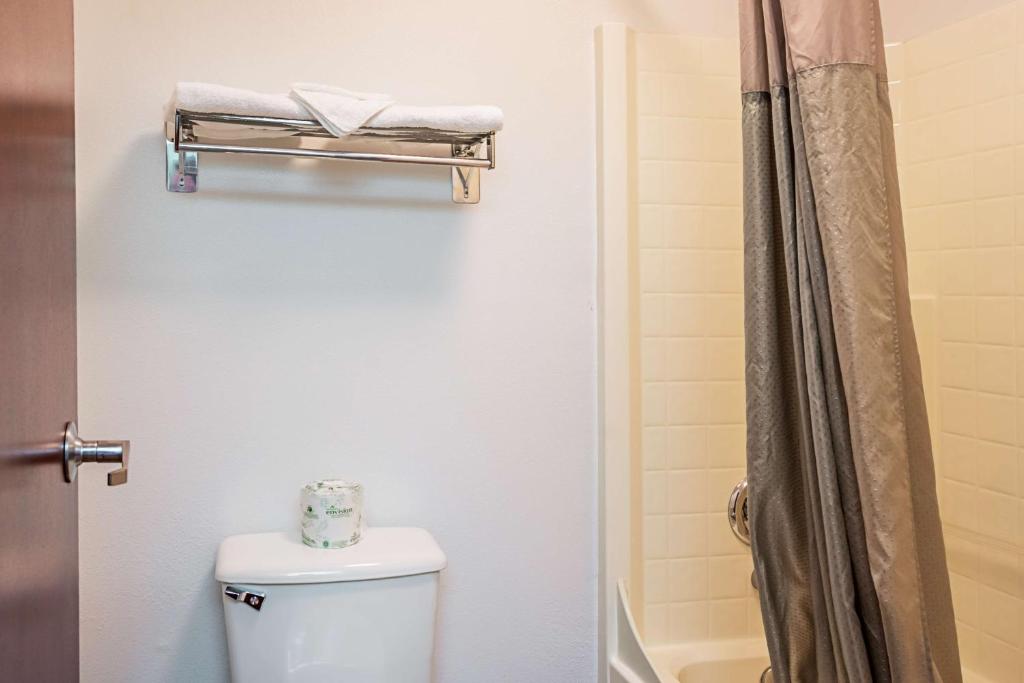 a bathroom with a toilet and a shower at Motel 6-Newport, OR in Newport