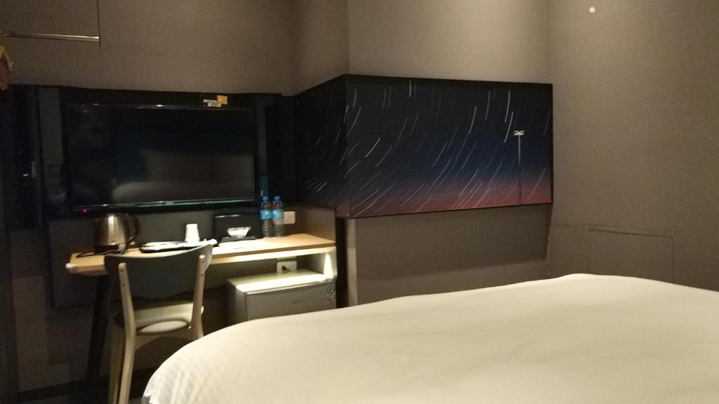 Postel nebo postele na pokoji v ubytování Walker-Taoyuan