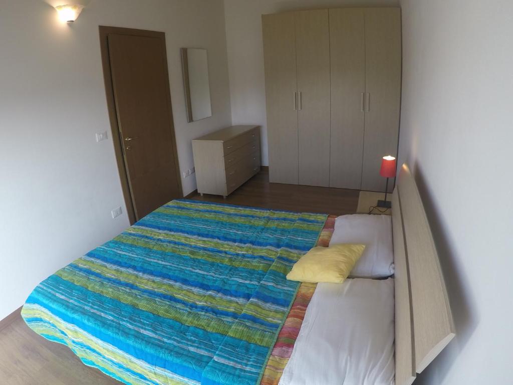 Postel nebo postele na pokoji v ubytování Residence Caorle Apartments - Agenzia Cocal