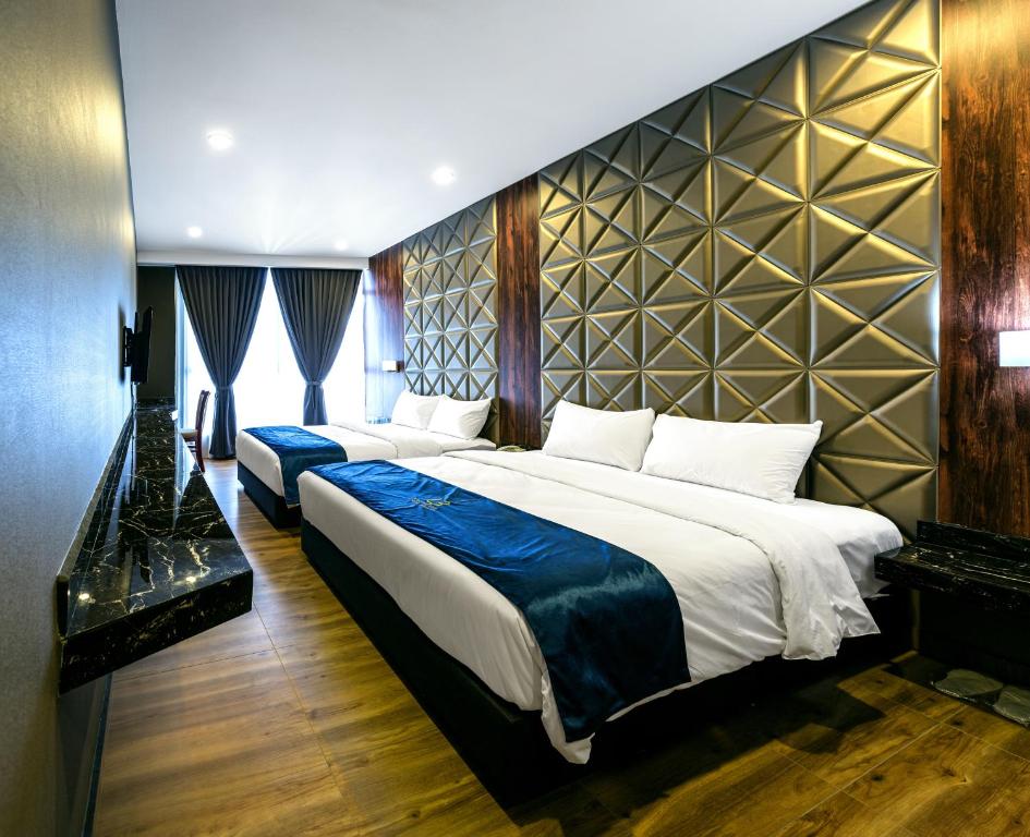 Postel nebo postele na pokoji v ubytování U3 HOTEL