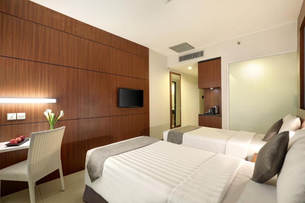 TV a/nebo společenská místnost v ubytování Hotel Neo Palma Palangkaraya by ASTON