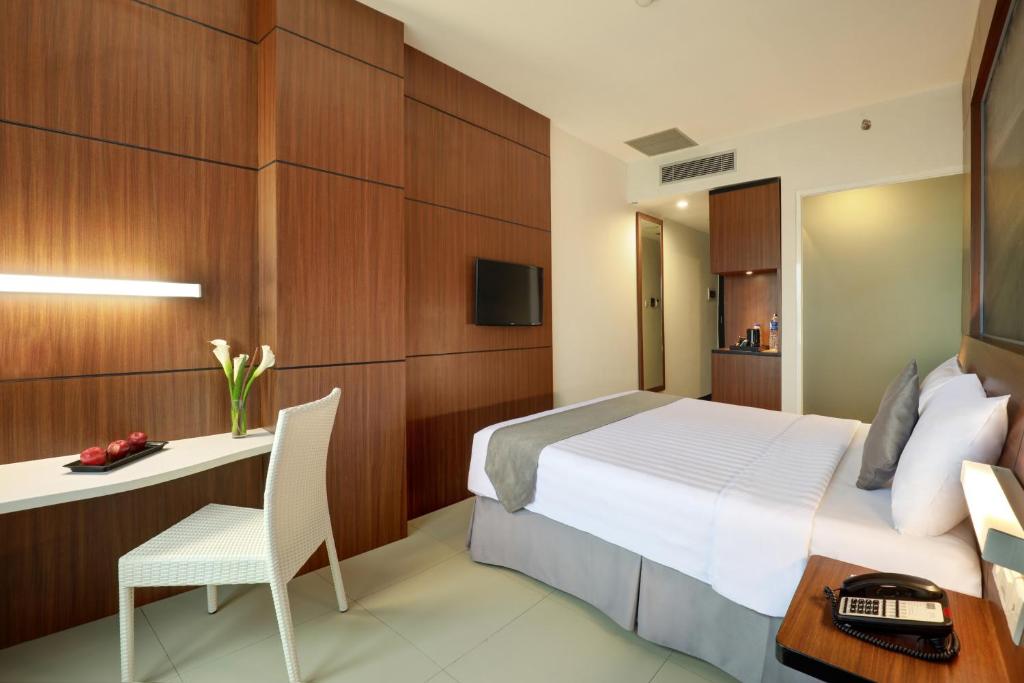 TV a/nebo společenská místnost v ubytování Hotel Neo Palma Palangkaraya by ASTON