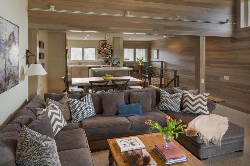 a living room with a couch and a table at Ridge 91 in Elkhorn Village