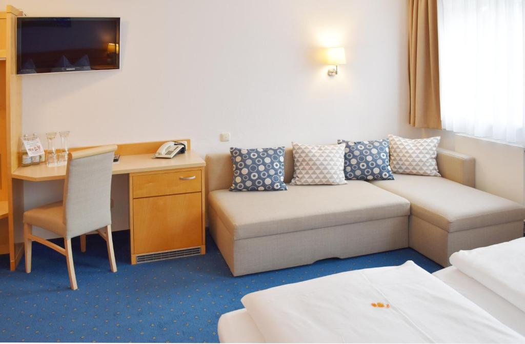 Postel nebo postele na pokoji v ubytování Hotel Nummerhof