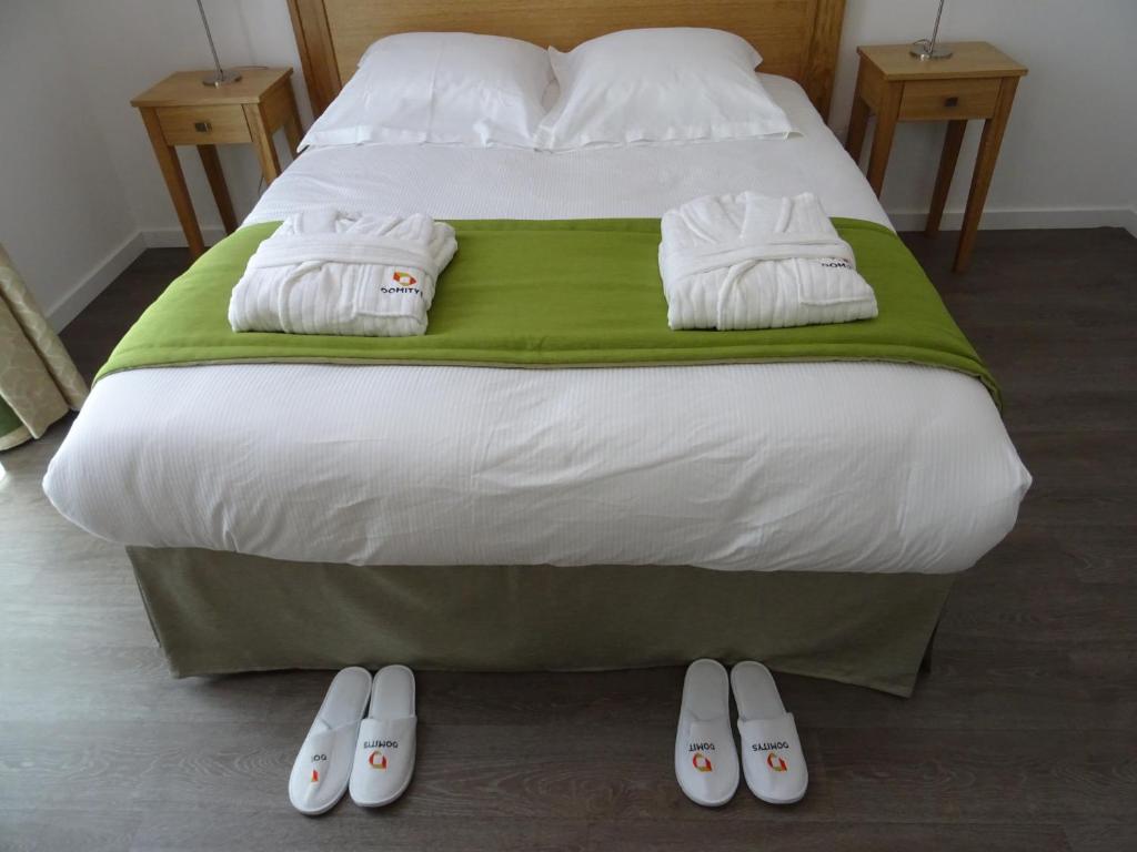 Een bed of bedden in een kamer bij Domitys Sophia