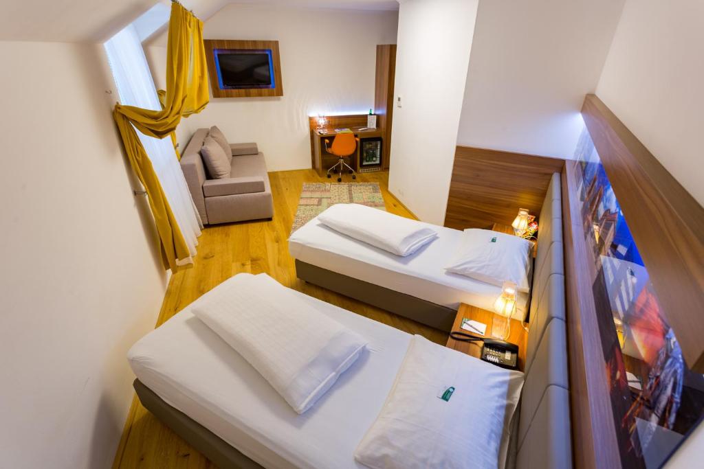 Postel nebo postele na pokoji v ubytování Hotel Kongress