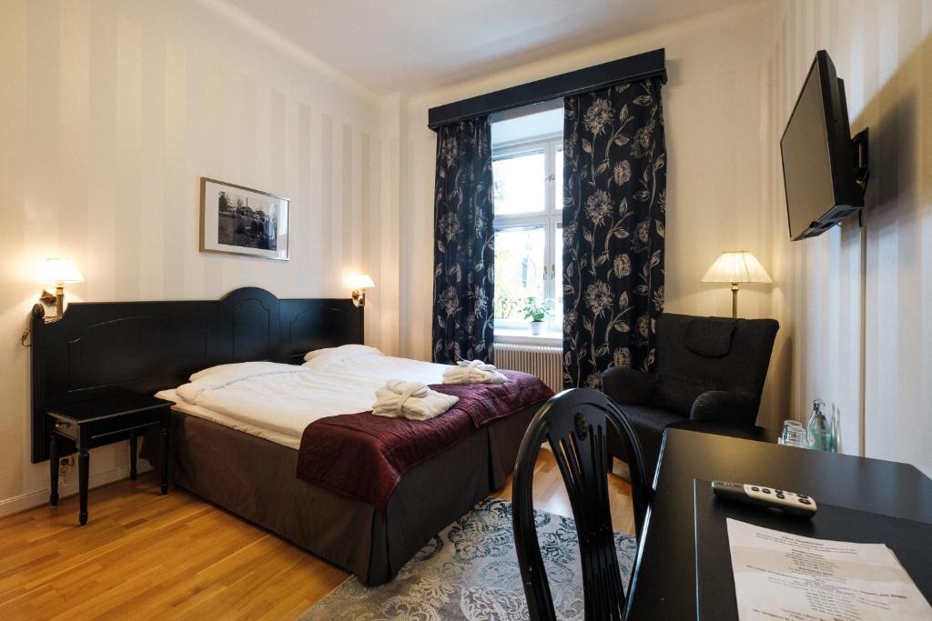Postel nebo postele na pokoji v ubytování Badhotellet Spa & Konferens