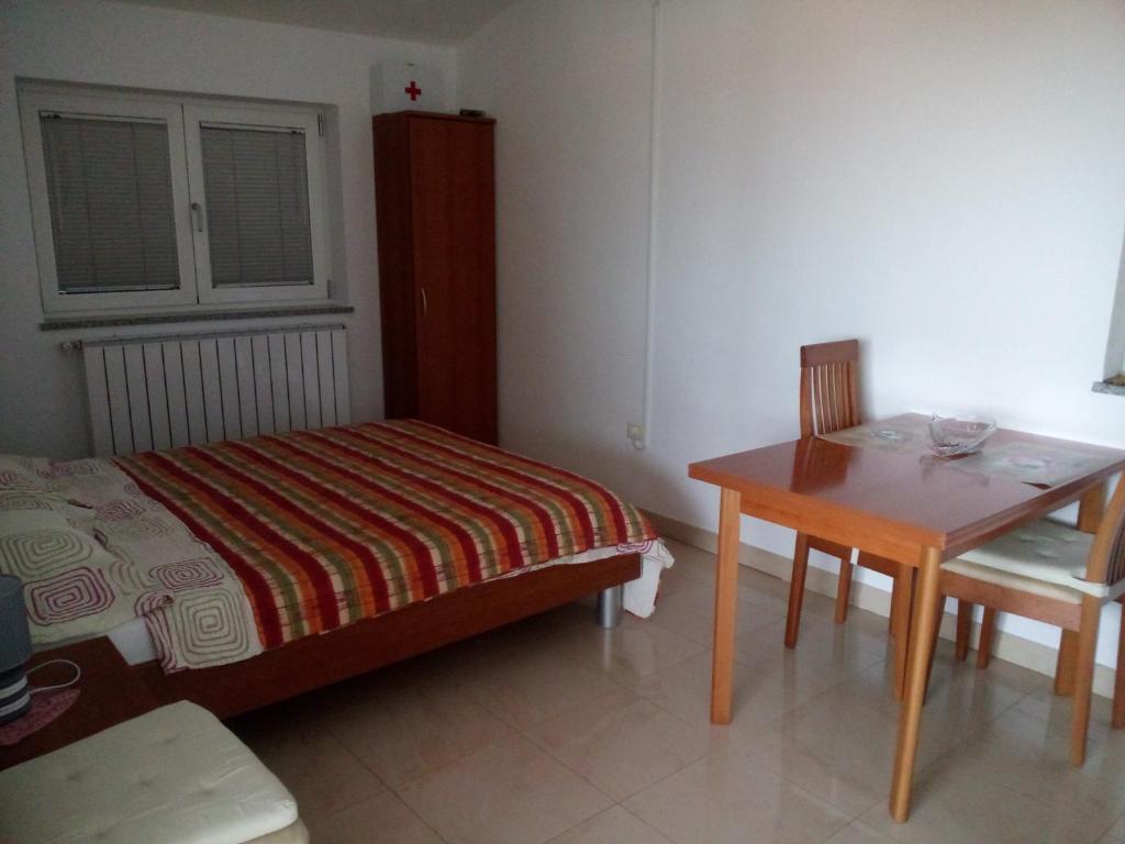 Postel nebo postele na pokoji v ubytování Apartments Villa Fernetich