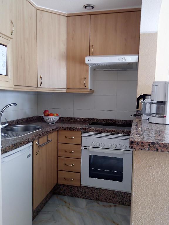 Kuchyň nebo kuchyňský kout v ubytování Apartamento Altamira