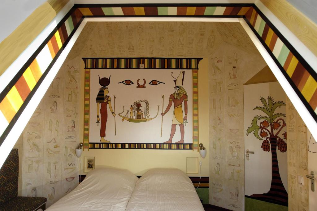 Postel nebo postele na pokoji v ubytování Hotel de Plataan Delft Centrum