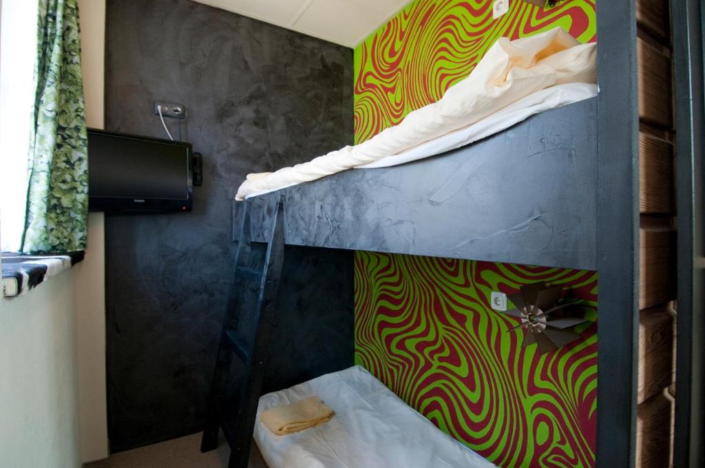 Postel nebo postele na pokoji v ubytování Hotel de Plataan Delft Centrum