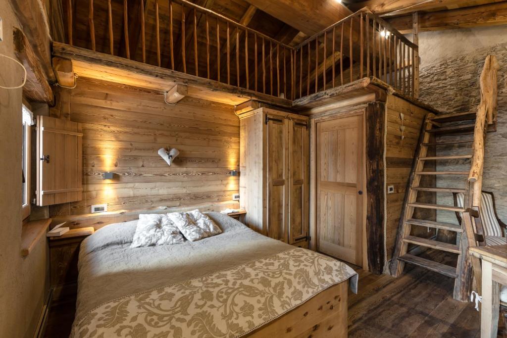 Postel nebo postele na pokoji v ubytování Brieis Relais Alpino