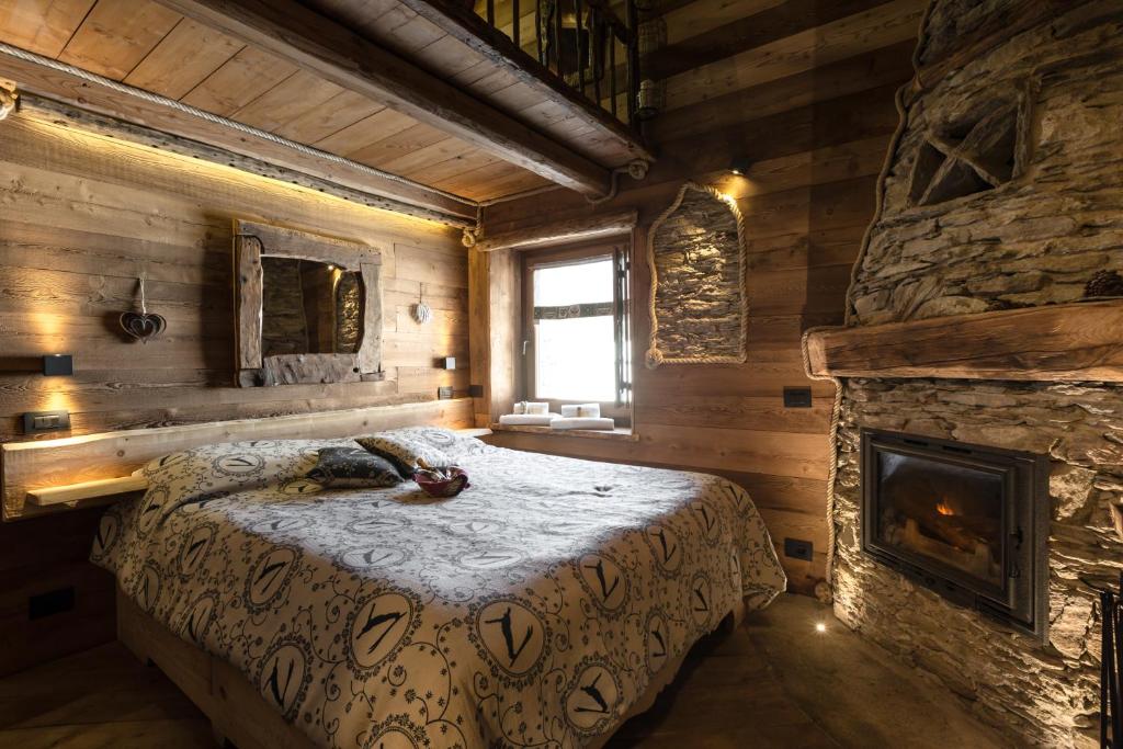 Postel nebo postele na pokoji v ubytování Brieis Relais Alpino
