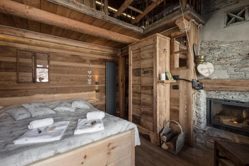 Postel nebo postele na pokoji v ubytování Brieis Relais Alpino