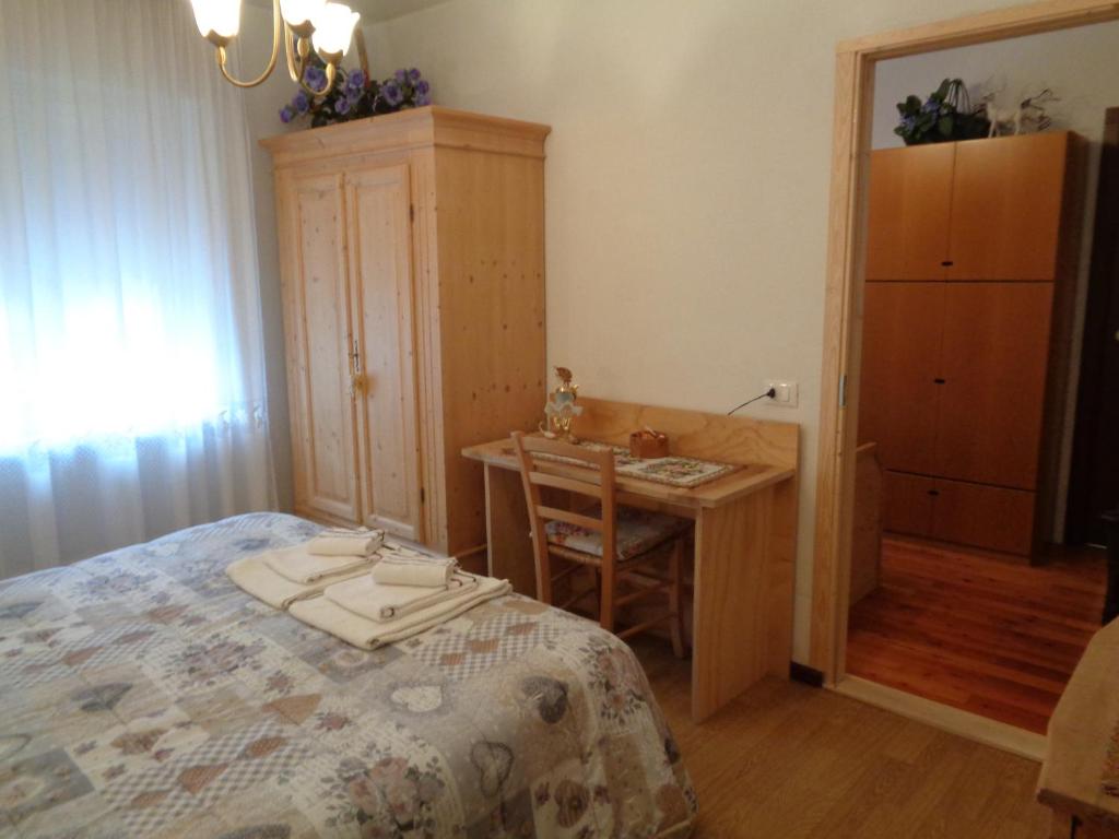 Postel nebo postele na pokoji v ubytování Casa Noemi Imer