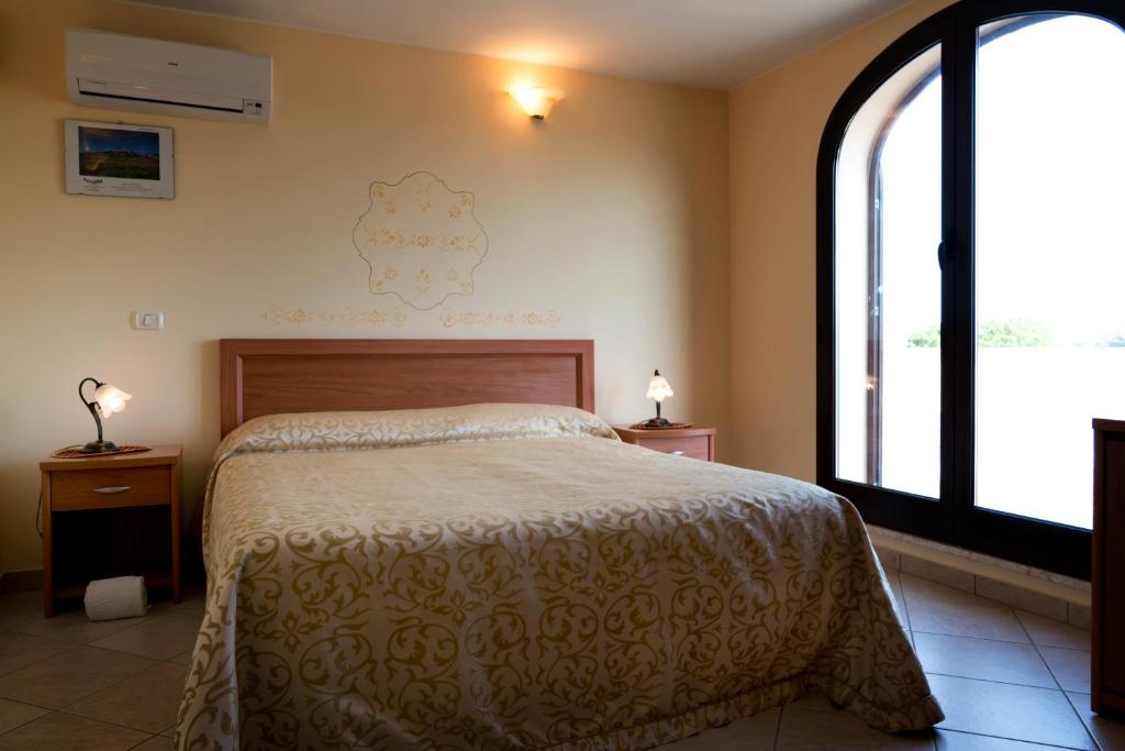 Postel nebo postele na pokoji v ubytování Hotel Salento