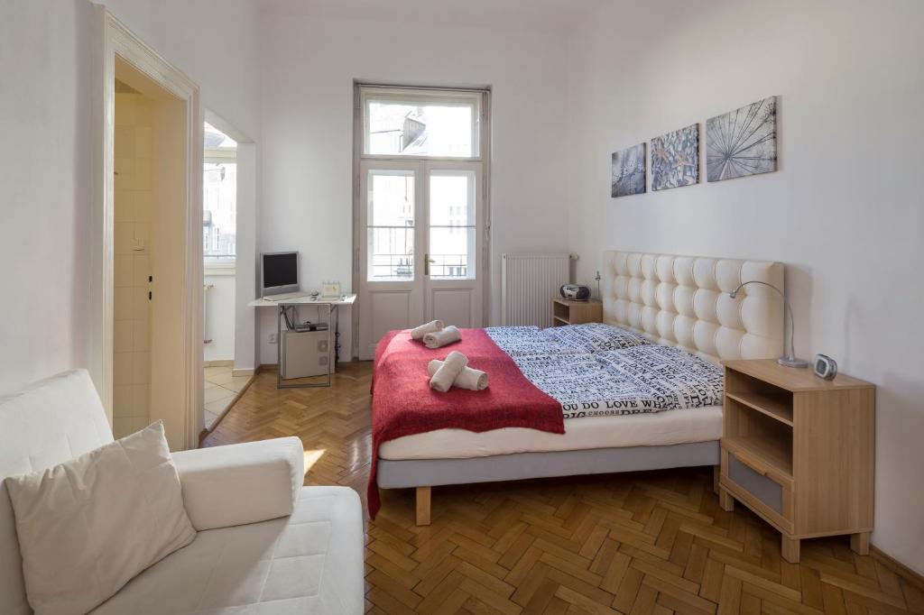 Postel nebo postele na pokoji v ubytování Dušní Apartments