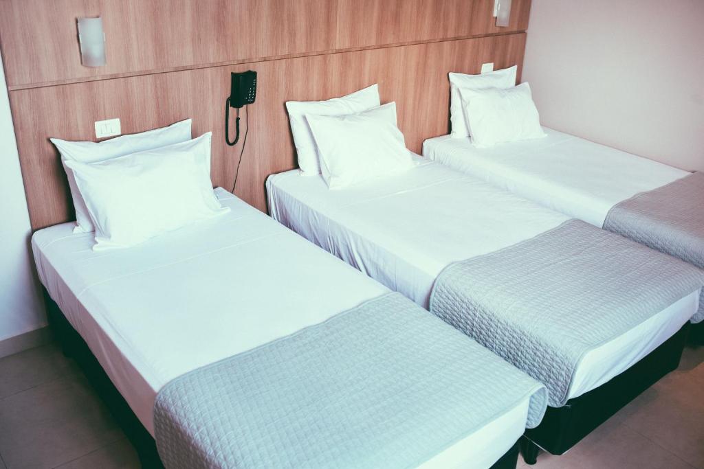 Postel nebo postele na pokoji v ubytování Occitano Apart Hotel