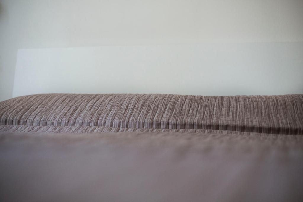 Postel nebo postele na pokoji v ubytování Affittacamere Caletta del Conero