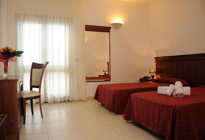 Postel nebo postele na pokoji v ubytování Agri Hotel Conte Salentino
