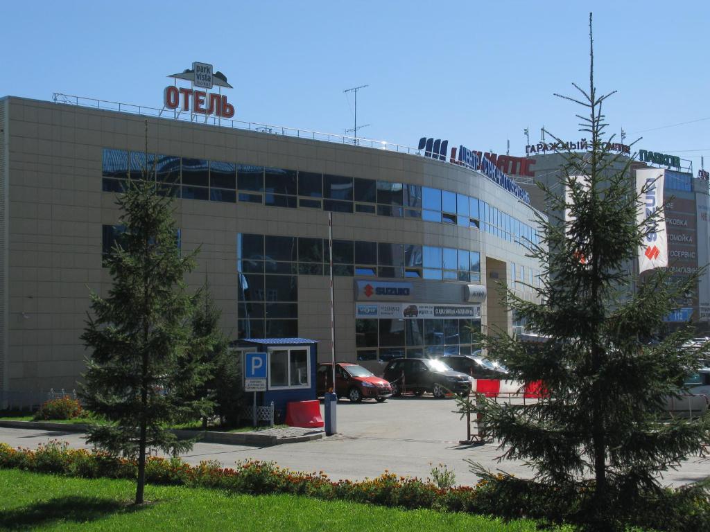 a office building with trees in front of it at Park Vista in Yekaterinburg