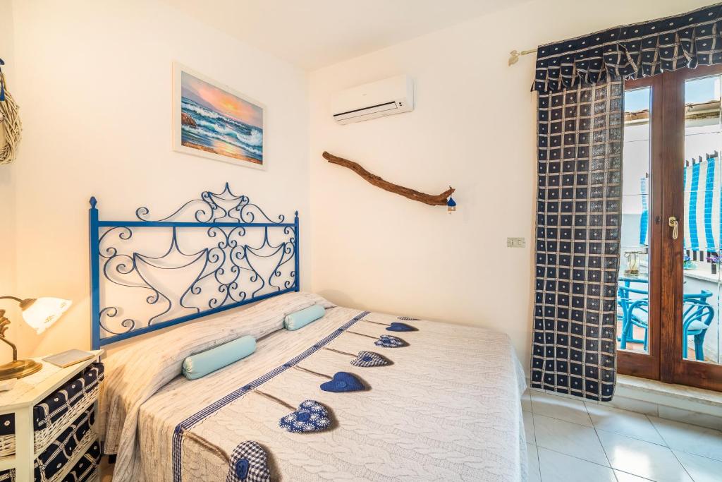 Posteľ alebo postele v izbe v ubytovaní B&B La Bouganville di Serena