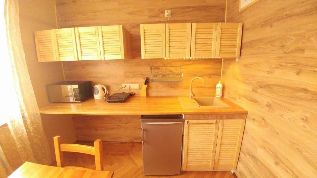 Kuchyň nebo kuchyňský kout v ubytování NavyBlue Apartments