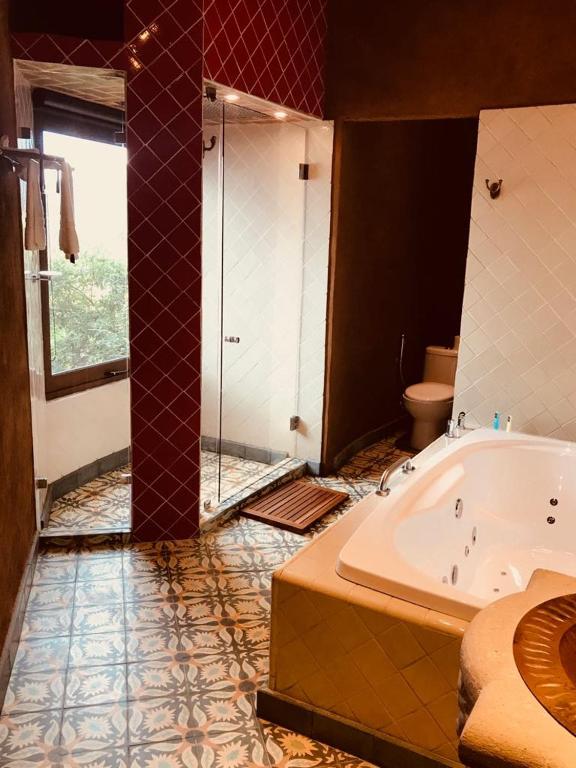 Postel nebo postele na pokoji v ubytování Hacienda Ucazanaztacua
