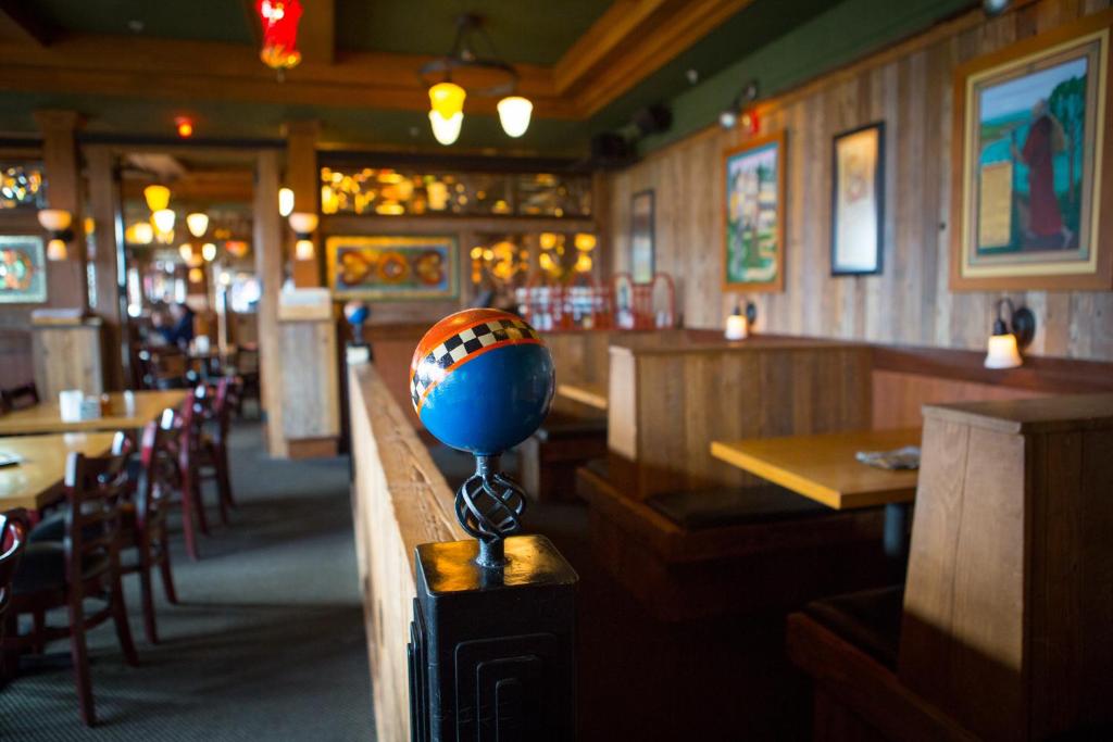 a restaurant with a ball on a counter in a room at McMenamins Gearhart Hotel in Gearhart
