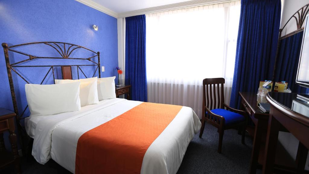 Postel nebo postele na pokoji v ubytování Hotel Ciros