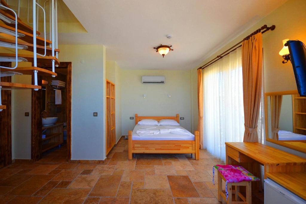 Ένα ή περισσότερα κρεβάτια σε δωμάτιο στο Doada Hotel