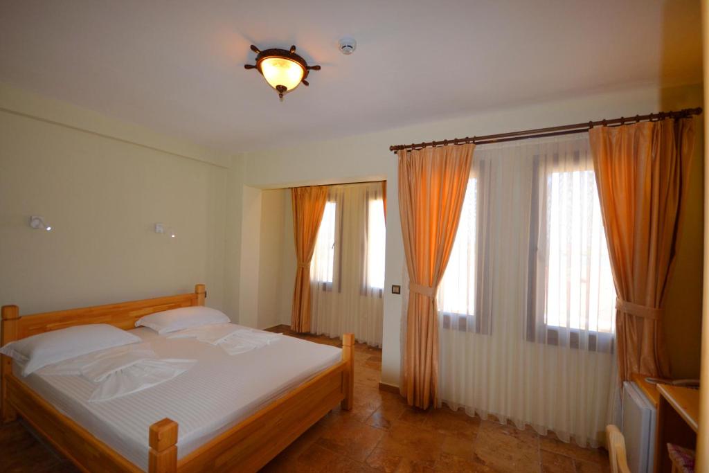 Ένα ή περισσότερα κρεβάτια σε δωμάτιο στο Doada Hotel