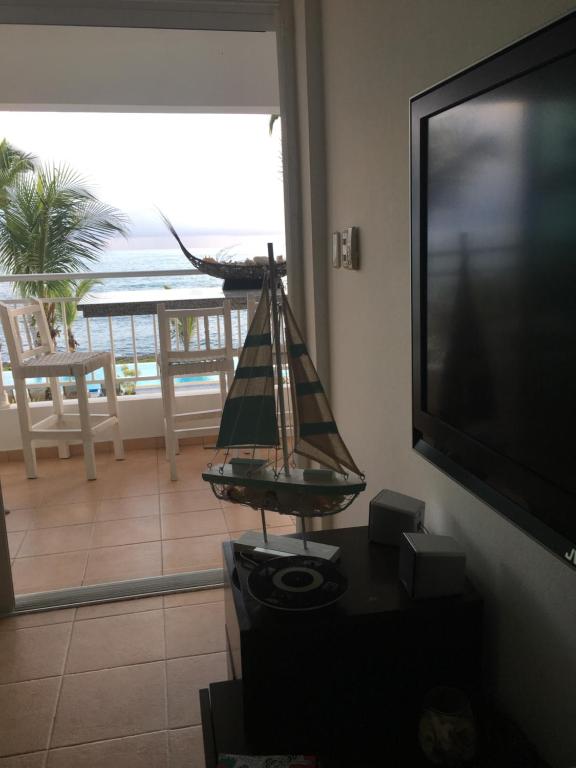 TV a/nebo společenská místnost v ubytování Apartamento Juan Dolio