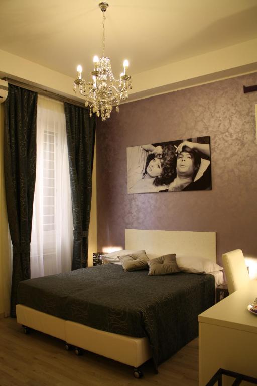 A bed or beds in a room at Residenza Elizabeth