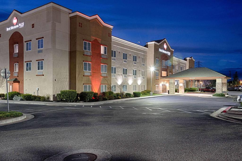 a large building with a clock on the front of it at Best Western Plus Delta Inn & Suites in Oakley