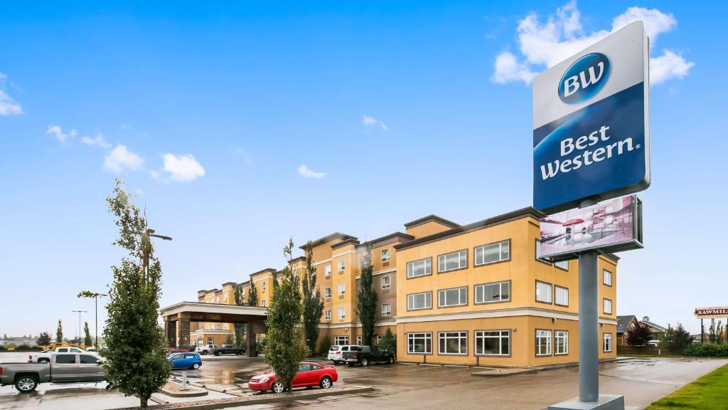 a building with a best western sign in a parking lot at Best Western Sunrise Inn & Suites in Stony Plain