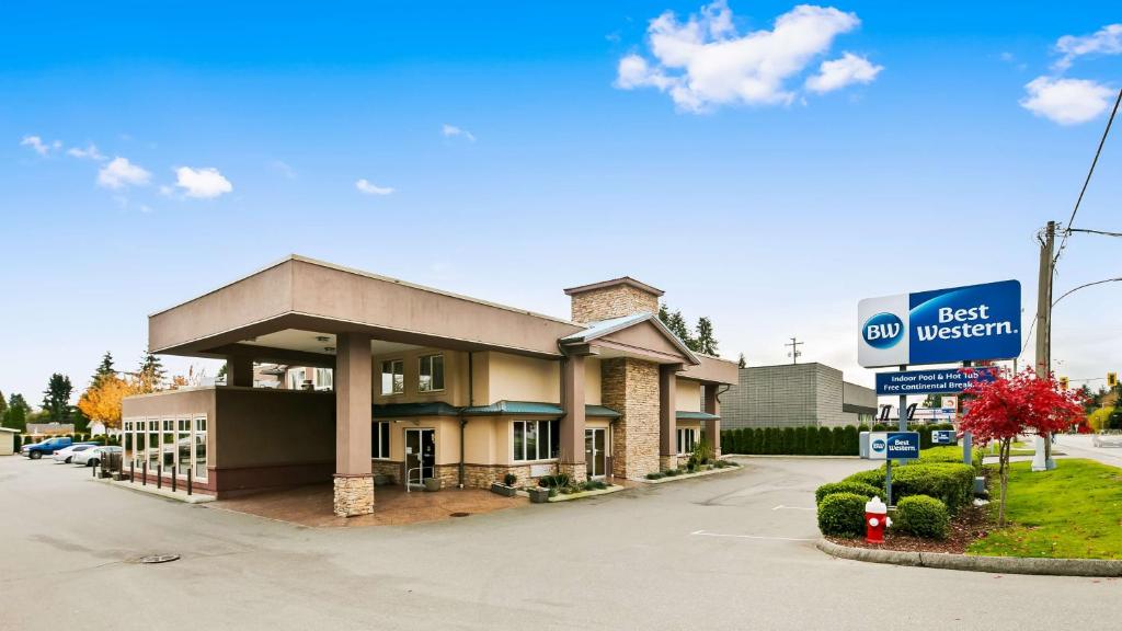 a best western inn with a sign in front of it at Best Western Maple Ridge in Maple Ridge