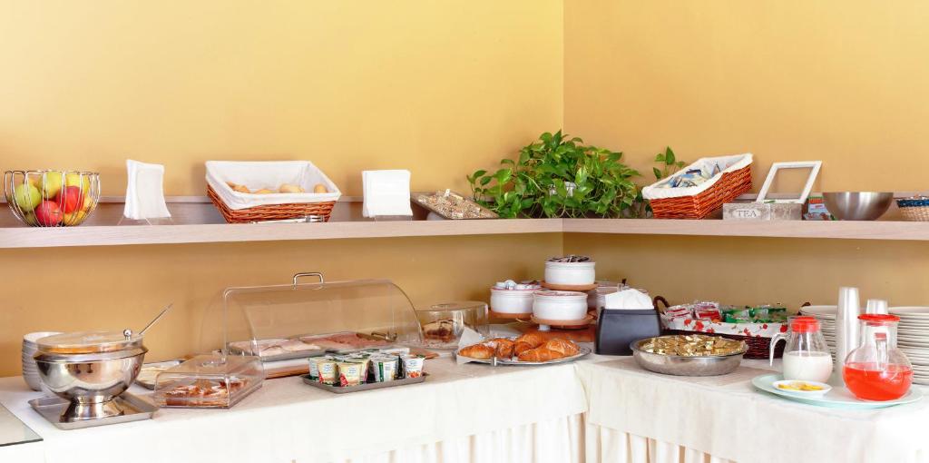 a buffet with food on a counter in a room at Villa Ambrosina in Impruneta